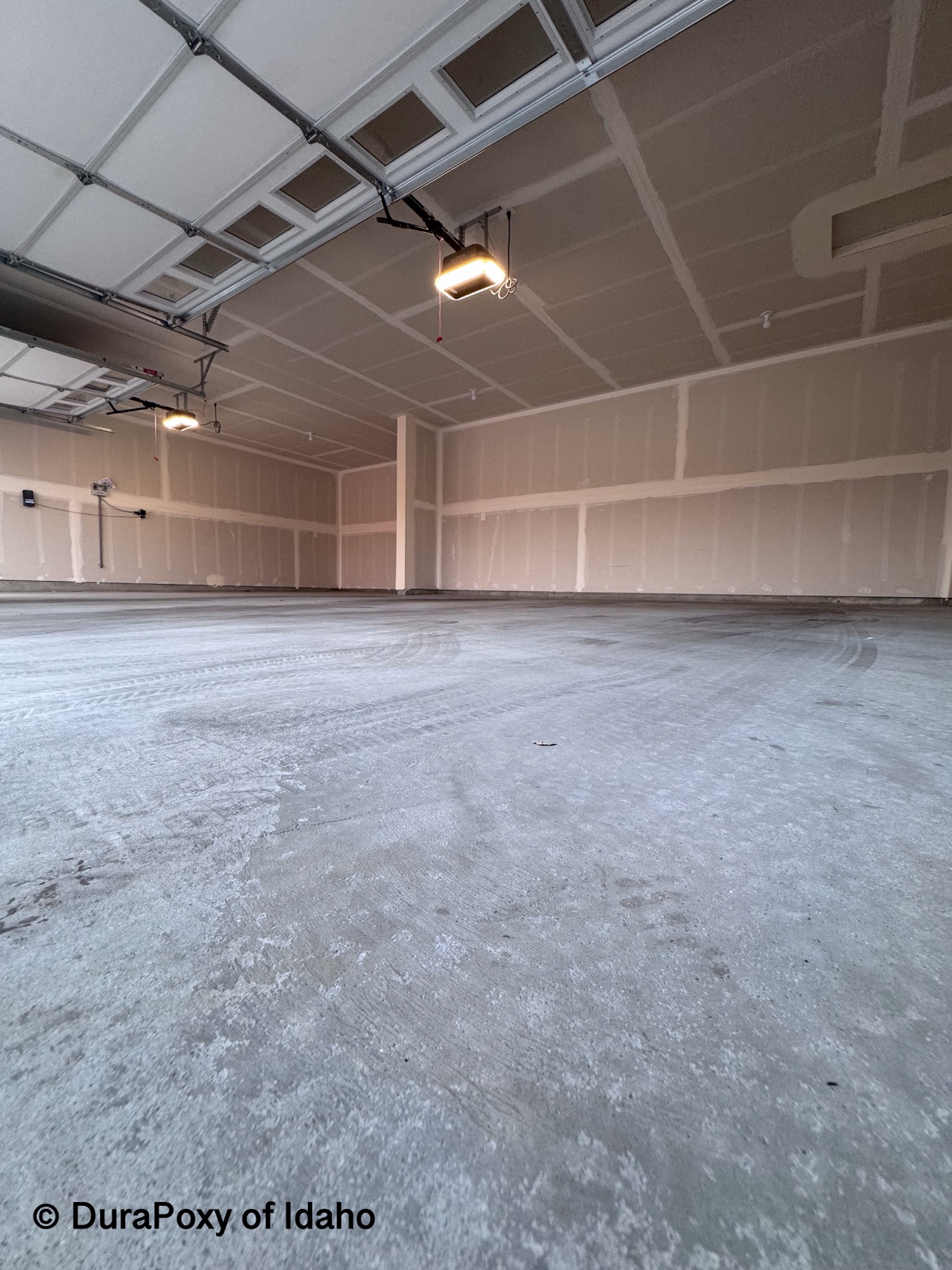 Bare concrete garage floor before DuraPoxy coating